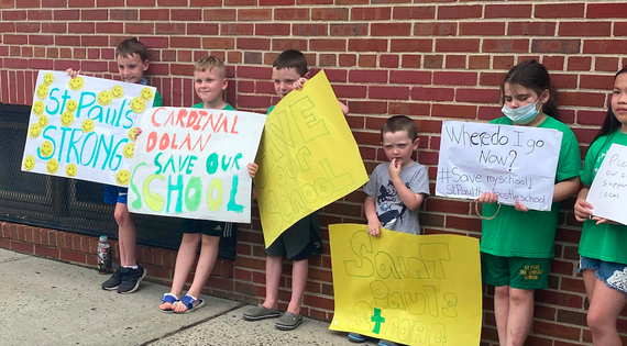 Children outside St. Paul’s on Saturday, rallying to save their school. Children outside St. Paul’s on Saturday, rallying to save their school.