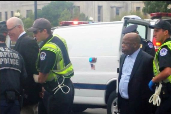 Former Congressman Joe Crowley and John Lewis getting arrested. Former Congressman Joe Crowley and John Lewis getting arrested.