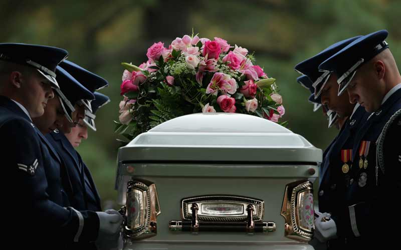 An Air Force Honor Guard casket team moves Maureen O'Hara’s casket into place before she is buried at Arlington National Cemetery on November 9, 2015. CREDIT: Chip Somodevilla/Getty Images