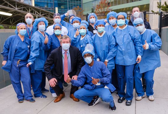 Dowling photographed with frontline workers. Dowling photographed with frontline workers.