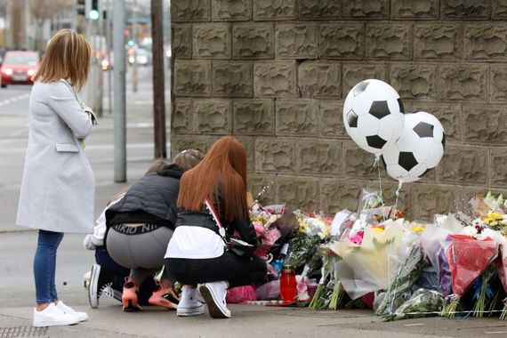 Jan 28, 2021: tributes left at the scene on East Wall Road where teenager Josh Dunne was fatally stabbed on January 26. (RollingNews.ie)
