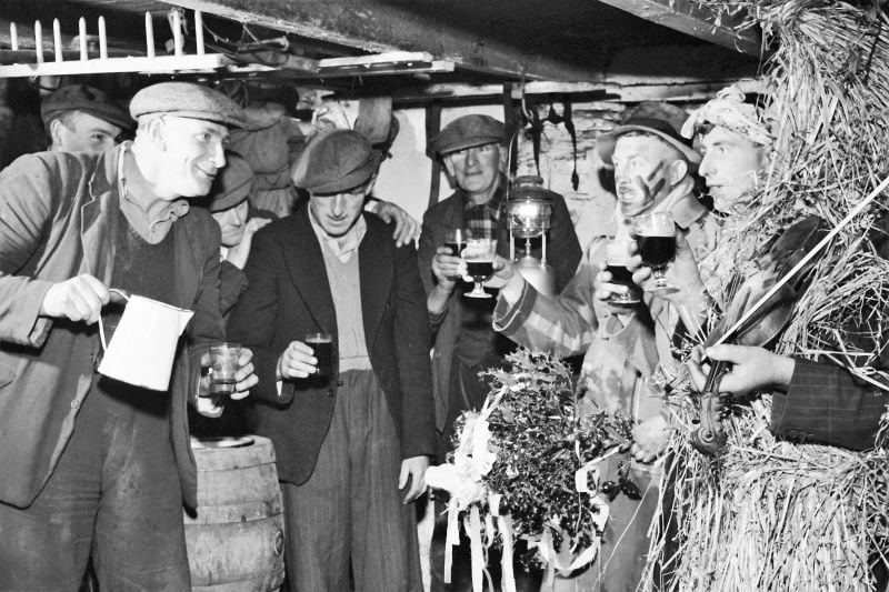 A group of mummers in Ireland celebrate St Stephen's Day or 'Wren's Day' on 26th December by processing from house to house with their instruments, and are rewarded with a glass of porter, circa 1955. (Getty Images)