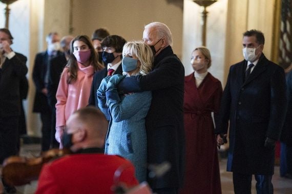 President Joe Biden embraces First Lady Dr. Jill Biden in the Grand Foyer of the White House Wednesday, Jan. 20, 2021, as the United States Marine Band plays to welcome them to the White House. President Joe Biden embraces First Lady Dr. Jill Biden in the Grand Foyer of the White House Wednesday, Jan. 20, 2021, as the United States Marine Band plays to welcome them to the White House.