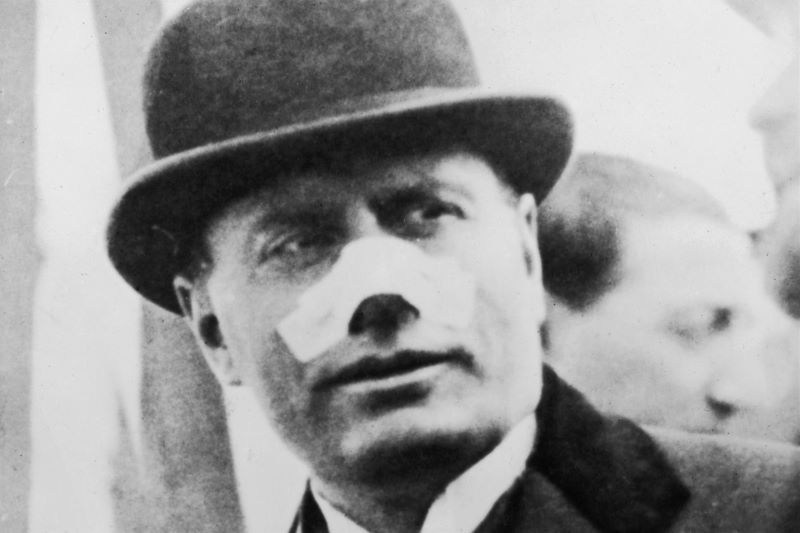 May 13, 1926: Benito Mussolini leaving for Tripoli. His nose is bandaged after an assassination attempt on 26th April by Violet Gibson, who shot him with a revolver at close range. (Getty Images)