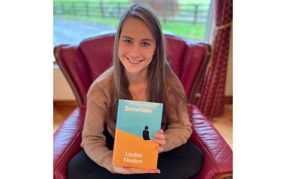 Louise Nealon holding her first novel, Snowflake. Louise Nealon holding her first novel, Snowflake.