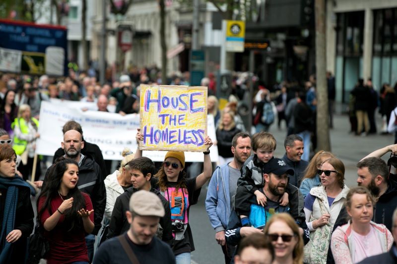 May 2019: Activists with the Raise the Roof campaign protest march through Dublin city center demanding houses for all and more to be done to help those who are homeless, including those in Direct Provision, Students and people living in hotel rooms across Ireland. (RollingNews.ie)