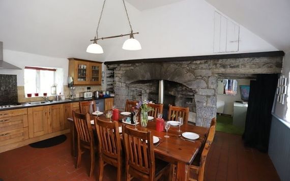 The inglenook fireplace and a solid fuel stove is the center piece of the kitchen/dining area The inglenook fireplace and a solid fuel stove is the center piece of the kitchen/dining area
