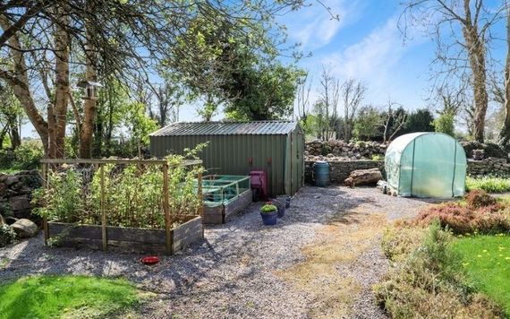 The property comes with a decking area and numerous sheds The property comes with a decking area and numerous sheds