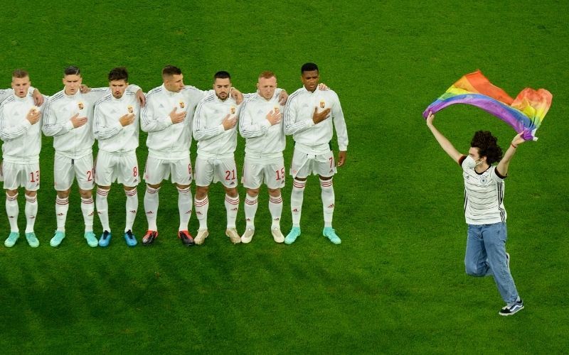 June 23, 2021: A pitch invader with a rainbow flag is seen on the pitch as the players line up prior to the UEFA Euro 2020 Championship Group F match between Germany and Hungary at Allianz Arena. (Getty Images)