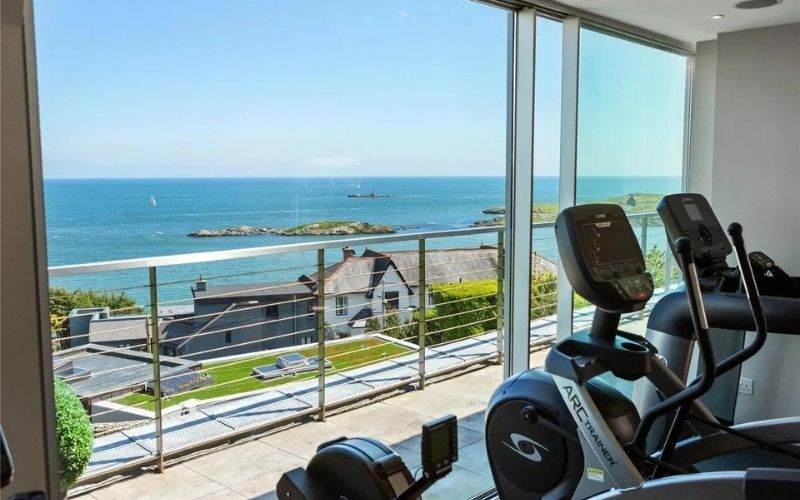 A home gym overlooks the sun terrace A home gym overlooks the sun terrace