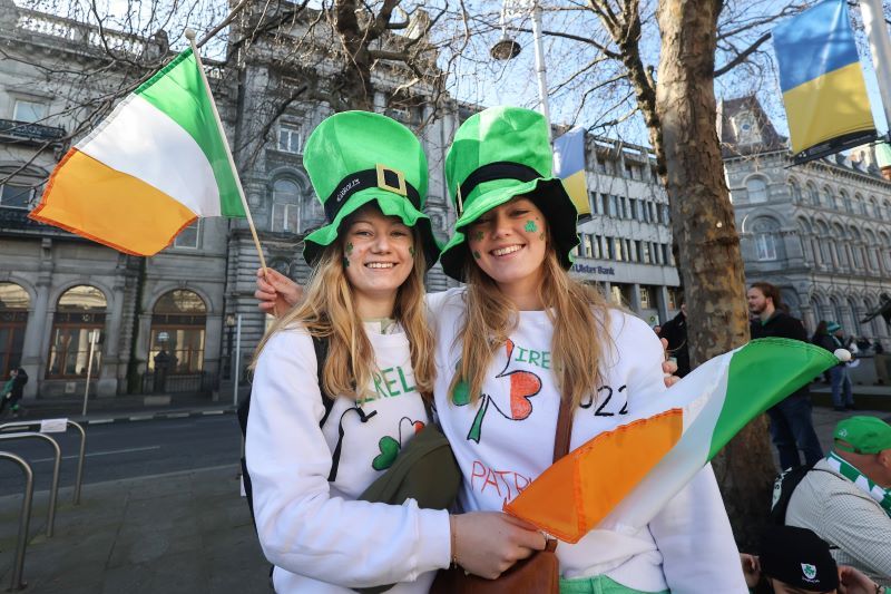 March 17, 2022: Mille Enggaard and Nanna Holm from Denmark with Irish flags as they prepare to enjoy the St. Patrick's Day parade. (RollingNews.ie