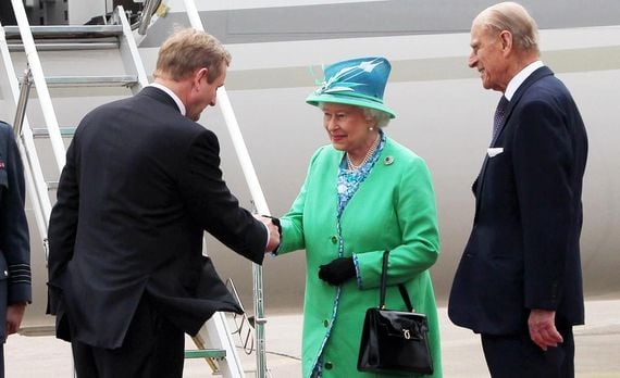 Queen Elizabeth II and Prince Phillip greeted by then-Taoiseach Enda Kenny for the historic state visit.