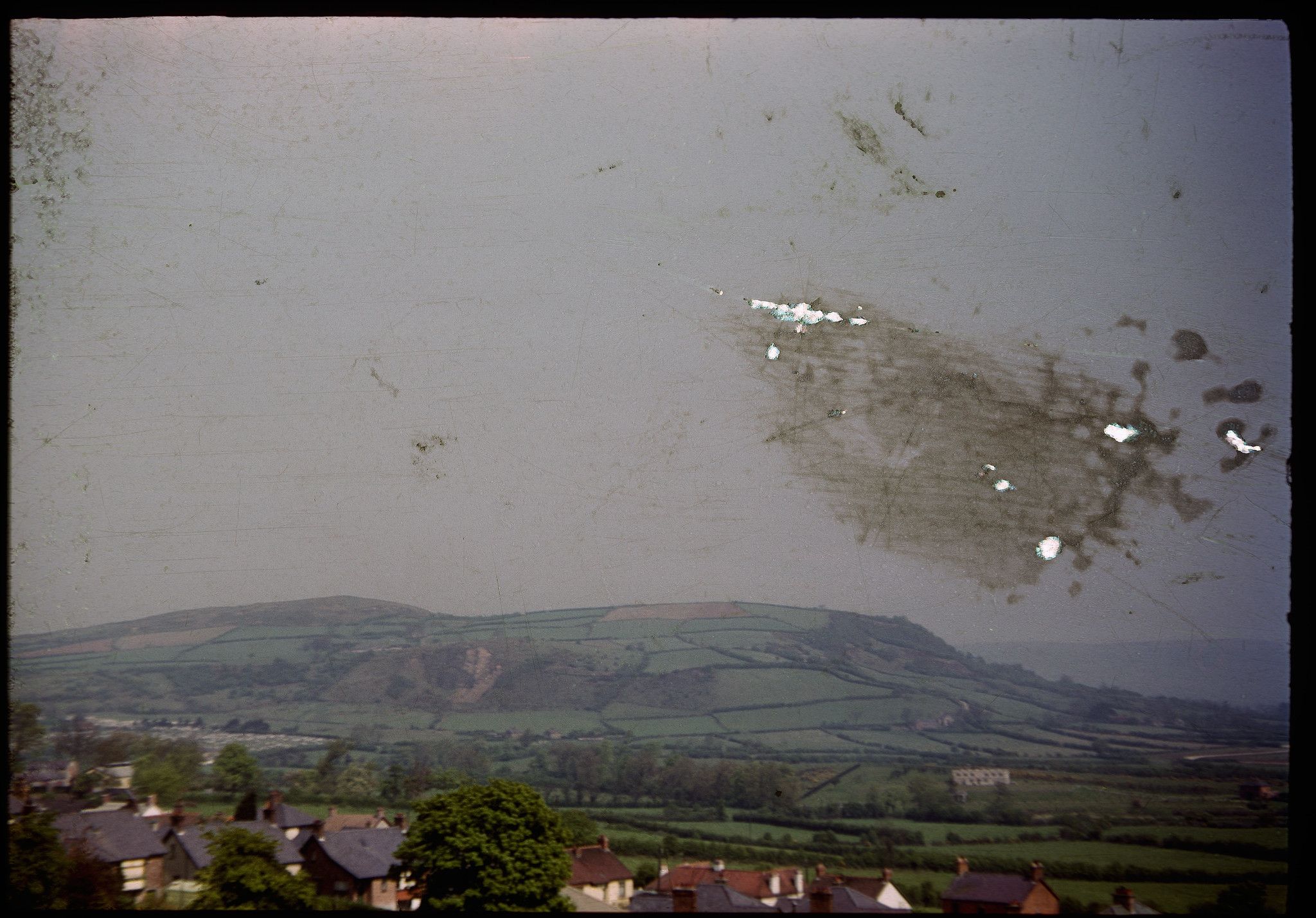 Belfast, Ireland, outskirts of city, May 1953. Note: Slide heavily damages in the sky area. Photo by Martin J. Walsh Jr, of Murdock Minnesota, Kodachrome slide.