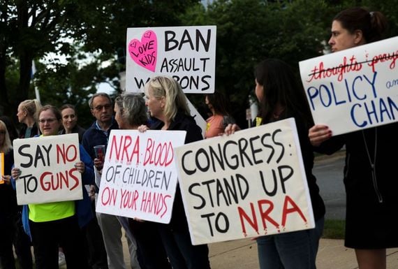 May 25, 2022: Gun-control advocates hold a vigil outside of the National Rifle Association (NRA) headquarters  in Fairfax, Virginia following the mass shooting at Robb Elementary School. (Getty Images)