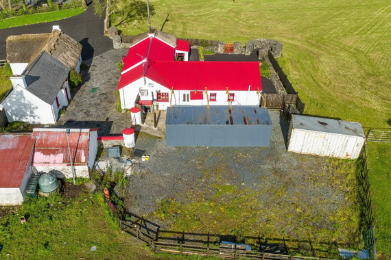 Aerial view of Hearty's Folk Cottage, home of The Red Fellas Bar, in Crossmaglen, County Armagh. Aerial view of Hearty's Folk Cottage, home of The Red Fellas Bar, in Crossmaglen, County Armagh.