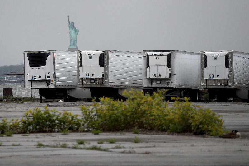 May 6, 2020: Refrigerated trucks functioning as temporary morgues at the South Brooklyn Marine Terminal in the Brooklyn borough of New York City. New York City's Medical Examiner are now operating a long-term disaster morgue at Brooklyn's 39th Street Pier, where human remains will be kept inside freezer trucks, in an effort to provide relief to funeral directors overwhelmed from the COVID-19 crisis. (Getty Images) May 6, 2020: Refrigerated trucks functioning as temporary morgues at the South Brooklyn Marine Terminal in the Brooklyn borough of New York City. New York City's Medical Examiner are now operating a long-term disaster morgue at Brooklyn's 39th Street Pier, where human remains will be kept inside freezer trucks, in an effort to provide relief to funeral directors overwhelmed from the COVID-19 crisis. (Getty Images)