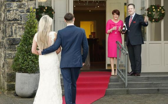 Sean and Elaine Lally welcome a newly married couple to Hotel Woodstock