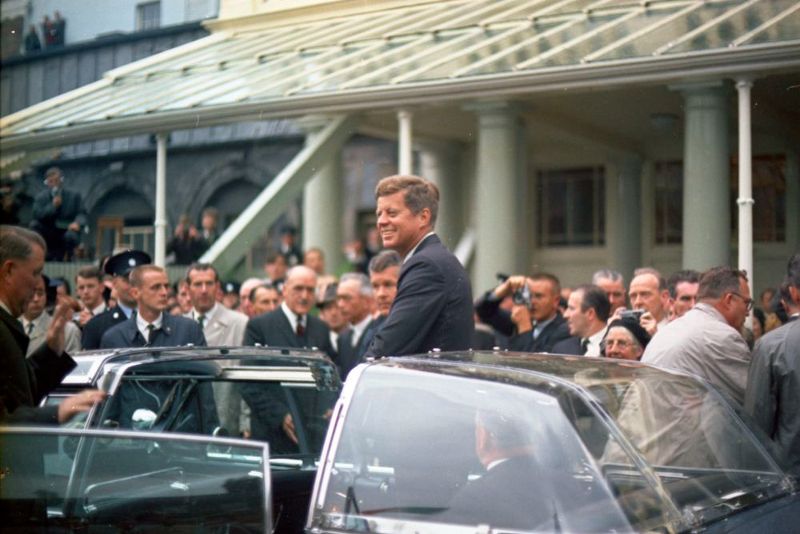 June 28, 1963: President John F. Kennedy in Dublin, Ireland with White House Secret Service agent Bill Greer (far left, at edge of frame). (Public Domain / JFK Library) June 28, 1963: President John F. Kennedy in Dublin, Ireland with White House Secret Service agent Bill Greer (far left, at edge of frame). (Public Domain / JFK Library)