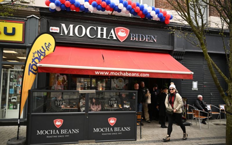 April 14, 2023: : A coffee shop is seen with adjusted signage for the arrival of US President Joe Biden. (Getty Images) April 14, 2023: : A coffee shop is seen with adjusted signage for the arrival of US President Joe Biden. (Getty Images)
