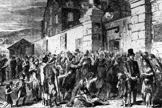 "The Irish Famine: Scene at the gate of a workhouse." (Via Getty).