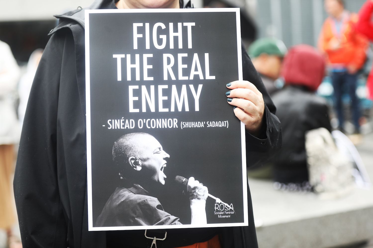 A mourner holding a sign at the tribute to Sinead O'Connor on Sunday outside Dublin City Hall. A mourner holding a sign at the tribute to Sinead O'Connor on Sunday outside Dublin City Hall.
