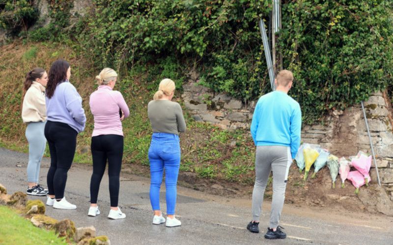 Friends of the victims lay flowers at the actual crash site on the Mountain Road in Clonmel Co Tipperary. Rolling News