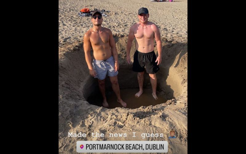 Charlie Wallace and a pal standing in the hole they dug on Portmarnock Beach, Dublin. Charlie Wallace and a pal standing in the hole they dug on Portmarnock Beach, Dublin.