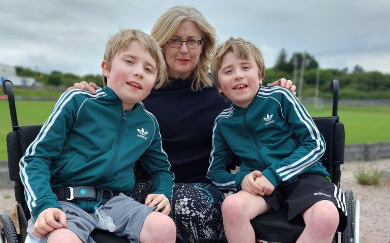 Paula with twins George and Isaac. Paula with twins George and Isaac.