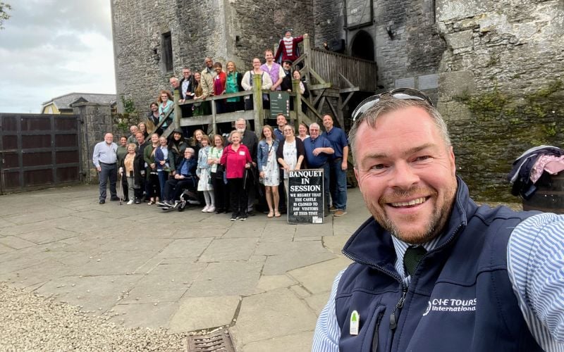 One of the expert tour guides on the CIE Tours of Ireland, Britain and beyond Tour Directors, Chris Whyte, with happy guests exploring iconic favorites on the Emerald Isle. One of the expert tour guides on the CIE Tours of Ireland, Britain and beyond Tour Directors, Chris Whyte, with happy guests exploring iconic favorites on the Emerald Isle.