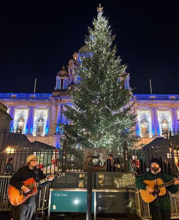 Musical duo Tessio perform outside City Hall as part of Belfast City Council’s festive music programme.
