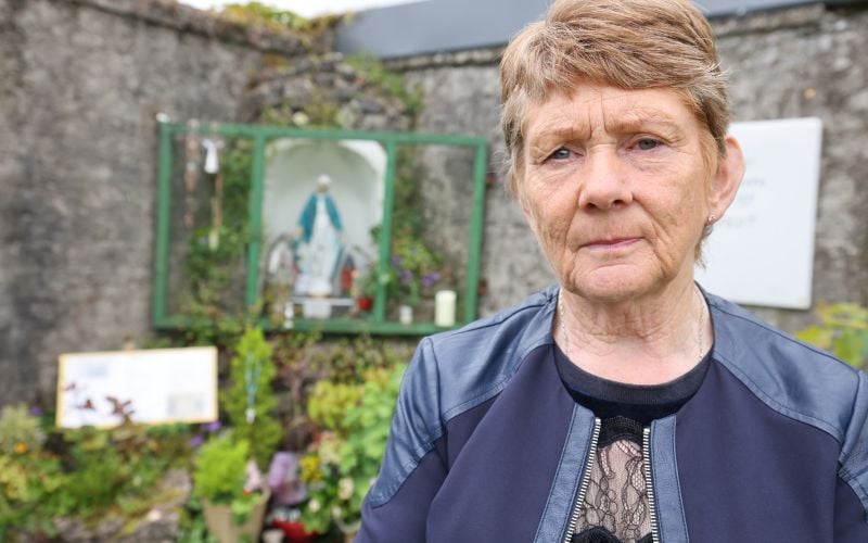 June 12, 2025: Catherine Corless at the site of the former Mother and Baby Home in Tuam, Co Galway ahead of the pre-excavation works. (RollingNews.ie) June 12, 2025: Catherine Corless at the site of the former Mother and Baby Home in Tuam, Co Galway ahead of the pre-excavation works. (RollingNews.ie)