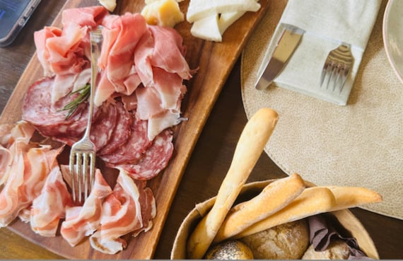 Plates of meat and cheese arrive at the superb Conti Thun report. Plates of meat and cheese arrive at the superb Conti Thun report.