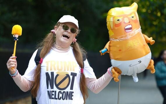 An anti-Trump protestor waiting outside the Shelbourne Hotel. Pic: RollingNews An anti-Trump protestor waiting outside the Shelbourne Hotel. Pic: RollingNews
