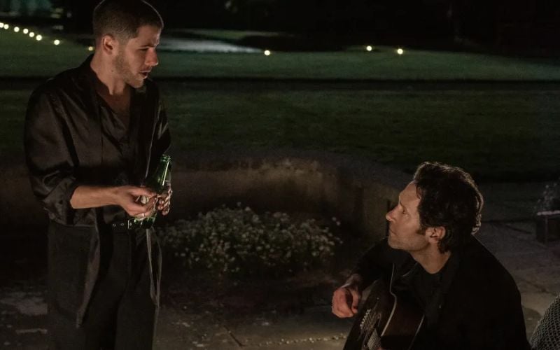 Nick Jonas and Paul Rudd in "Power Ballad".