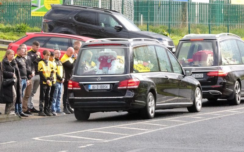 The English families coffins en route to their funeral while the public lines the roads to pay their respects.
