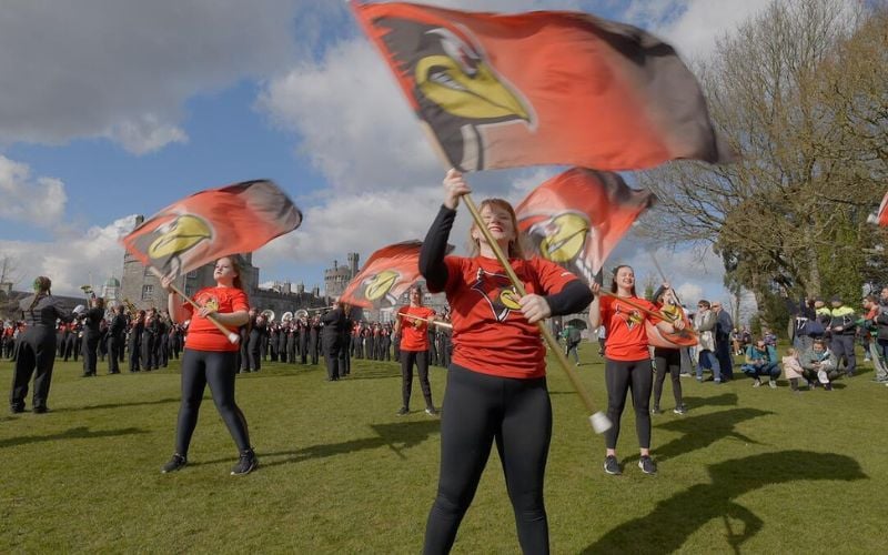A marching band performing outside Kilkenny Castle in 2025.