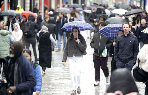 People walk with umbrellas on a wet rainy day on Henry Street Dublin. (Credit: Leah Farrell/© RollingNews.ie)