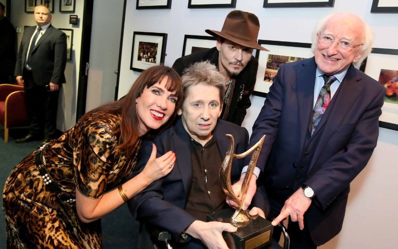Victoria Mary Clarke, Shane MacGowan, Johnny Depp, and then-President of Ireland Michael D Higgins at MacGowan's 60th birthday celebrations.