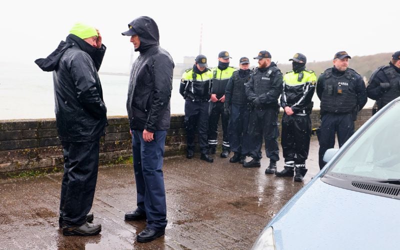 April 10, 2026:  A representative of the protestors (left) speaks with a Senior Garda Officer, as they discuss a way to end the deadlock and try to allow tankers to access the refinery in Whitegate, Co Cork. (RollingNews.ie)