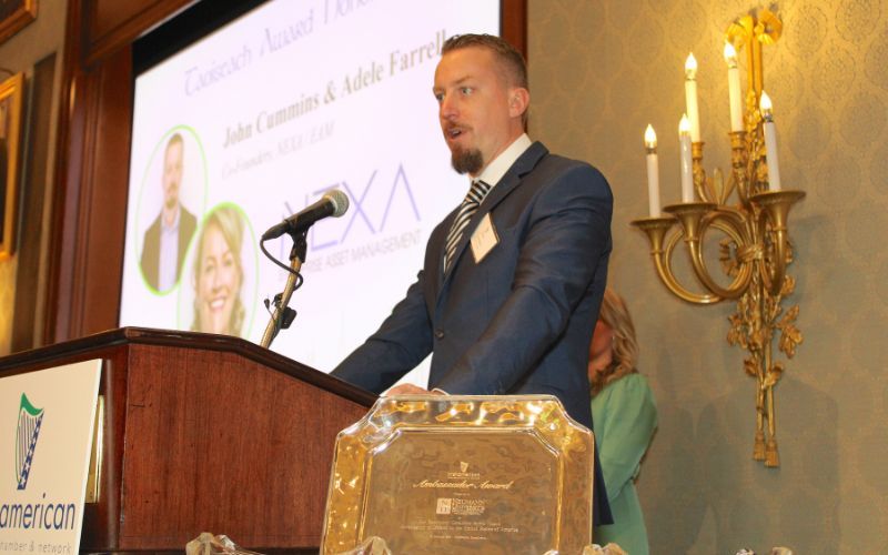 John Cummins speaking at the IABCN Ambassador Awards, in 2023.