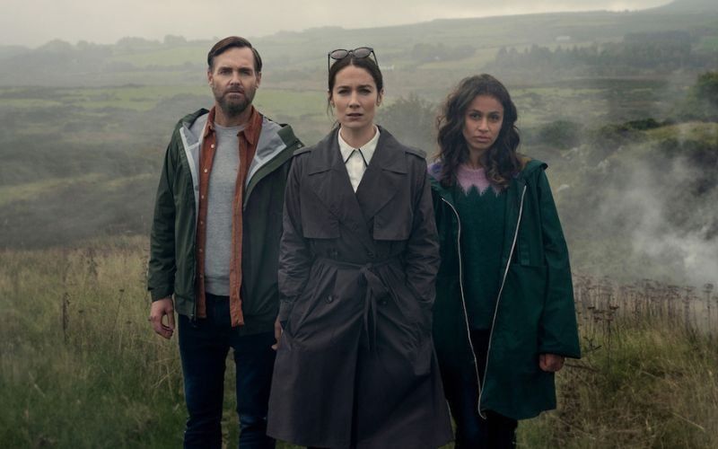 (L to R) Will Forte as Gilbert Power, Siobhán Cullen as Dove, and Robyn Cara as Emmy Sizergh in "Bodkin." (Enda Bowe / Netflix)