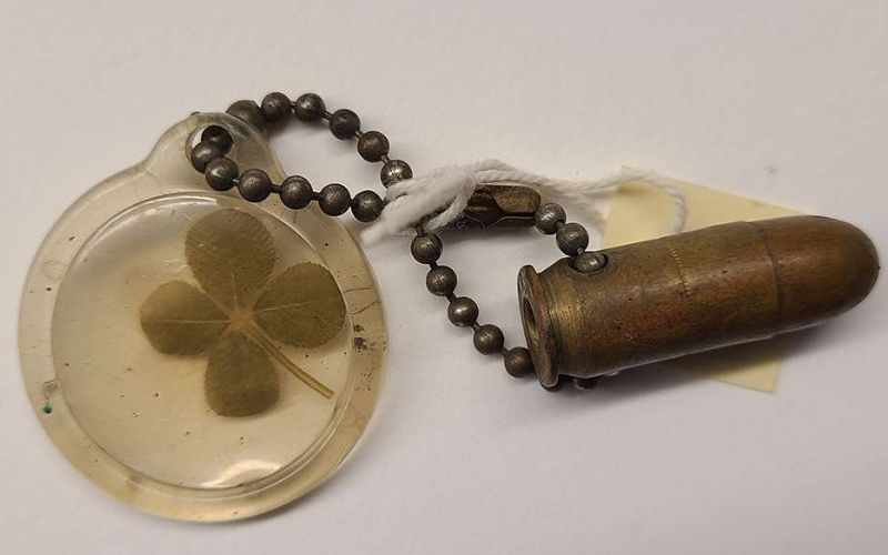Four-leaf clover lucky charm of Pfc. Joseph Robert Wallner, attached to a .45 caliber bullet. Gift of Sonja Wallner, 2012.034.029. (Image and description courtesy of the National World War II Museum / AIHS)