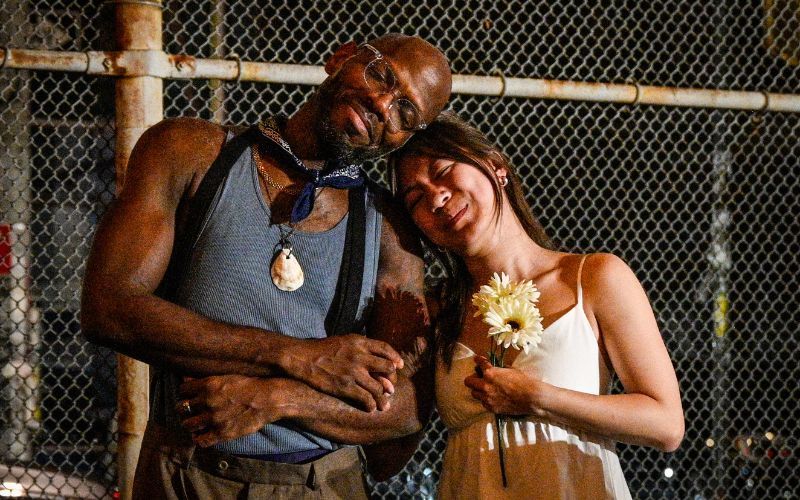Emmanuel Elpenord and Thammie Laine Quách as Oliver and Celia in The Drilling Company's FREE Shakespeare in the Parking Lot's "As You Like It." (Lee Wexler)