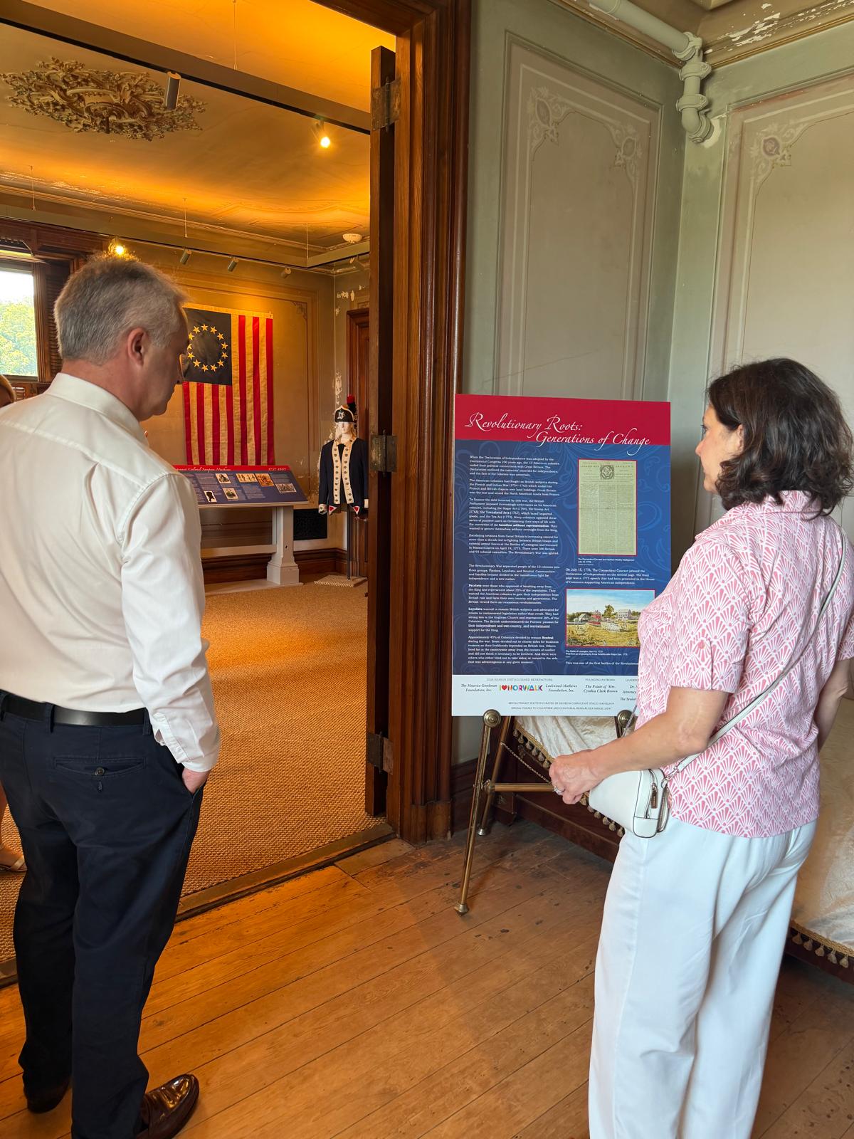 Consul General, Gerard Angley, and Norwalk, Connecticut Mayor, Barbara Smyth tour Lockwood- Mathews Mansion Museum's exhibition, Revolutionary Roots: Generations of Change Consul General, Gerard Angley, and Norwalk, Connecticut Mayor, Barbara Smyth tour Lockwood- Mathews Mansion Museum's exhibition, Revolutionary Roots: Generations of Change