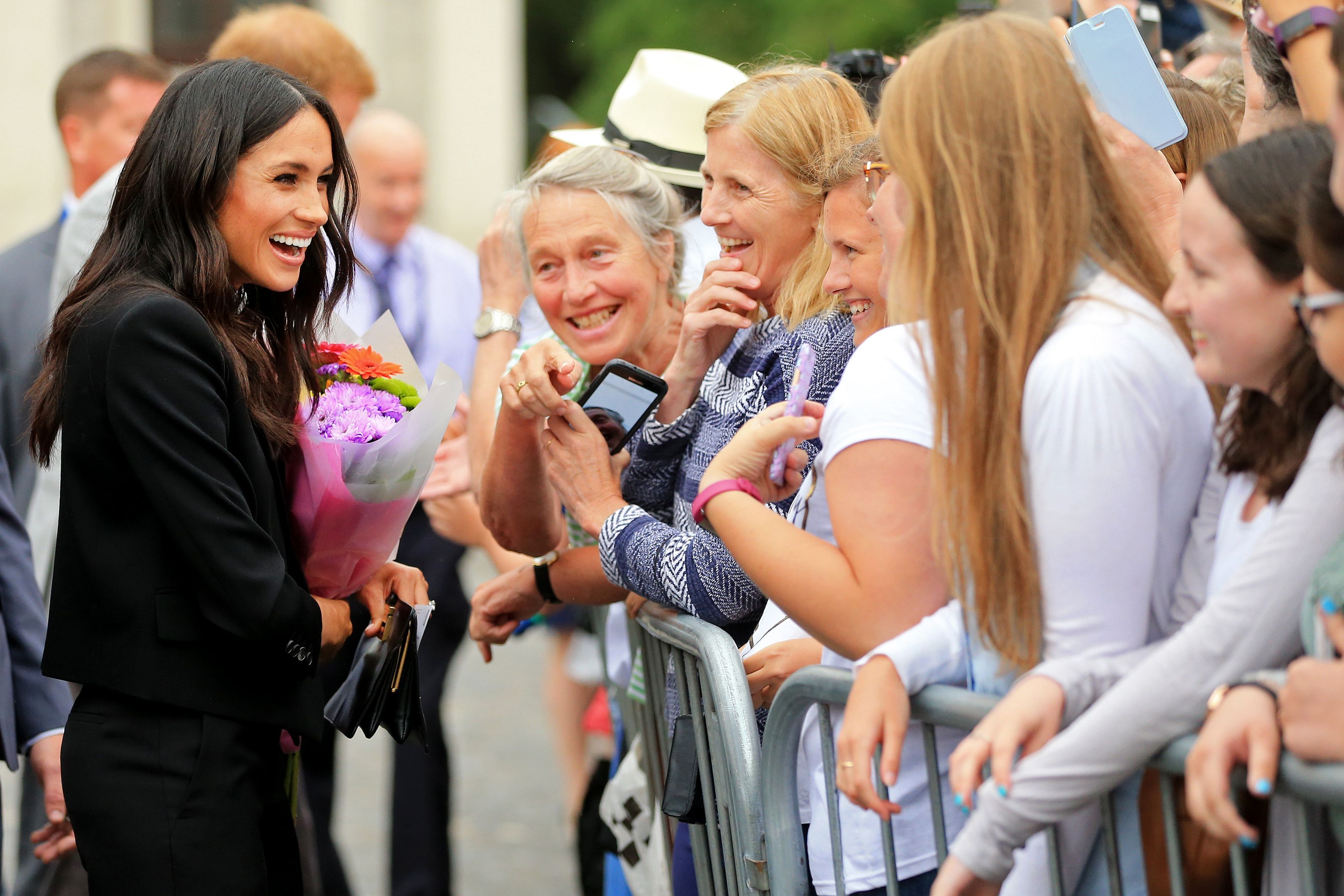 Britain's Meghan, Duchess of Sussex greets well-wishers after her visit with Britain's Prince Harry, Duke of Sussex to Trinity College in Dublin on the final day of their two day visit on July 11, 2018. GERRY MOONEY/AFP/Getty Images)