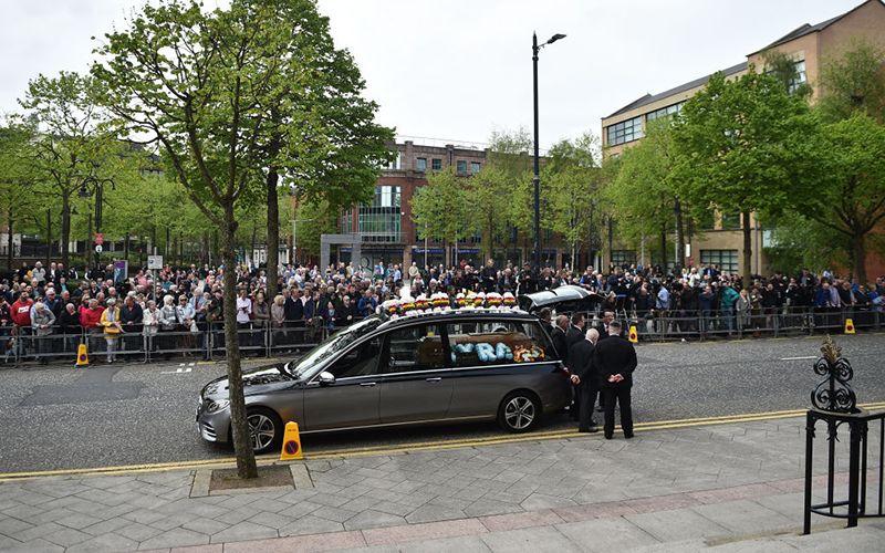 The public lines the street outside St. Anne's Cathedral in Belfast.