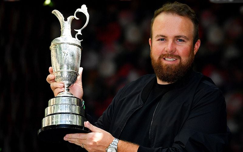 Shane Lowry holding The Open cup.