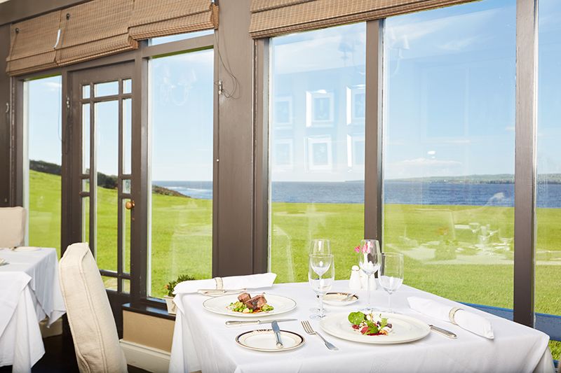 The dining room at Moy House looks out on the Atlantic Ocean