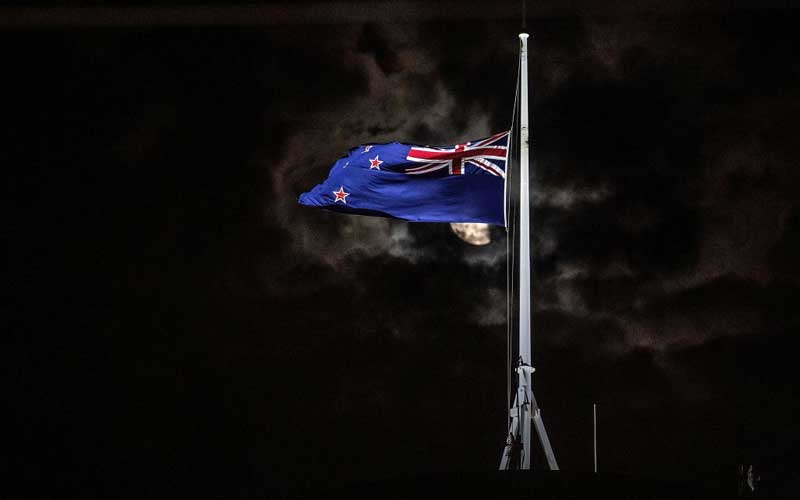 The New Zealand national flag is flown at half-mast on a Parliament building in Wellington after the attacks on two mosques in Christchurch. Credit: MARTY MELVILLE/AFP/Getty Images