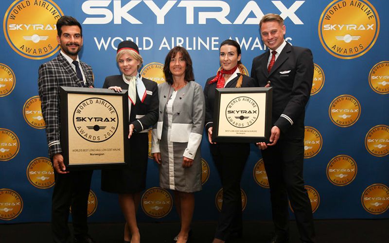 Norwegian's Chief Communications Officer Anne-Sissel Skånvik accepts the award with London Gatwick-based crew